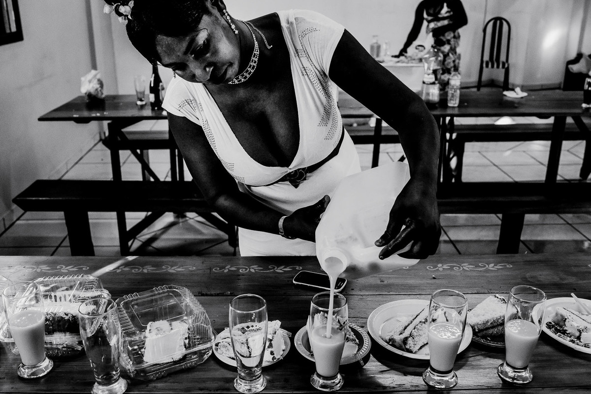 The Haitian bride made a liqueur similar to amarula that she served in a plastic bottle for her guests just as she also made her own wedding cake