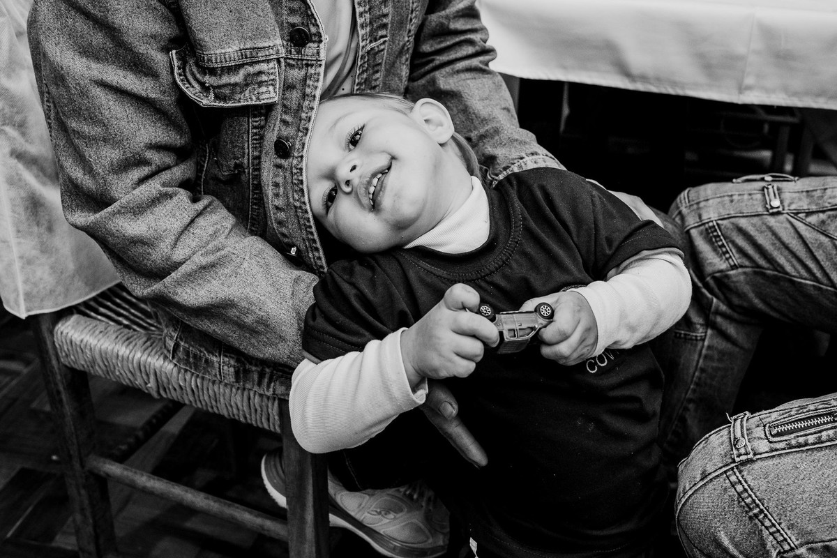 bw picture of a sweet child on his mom lap