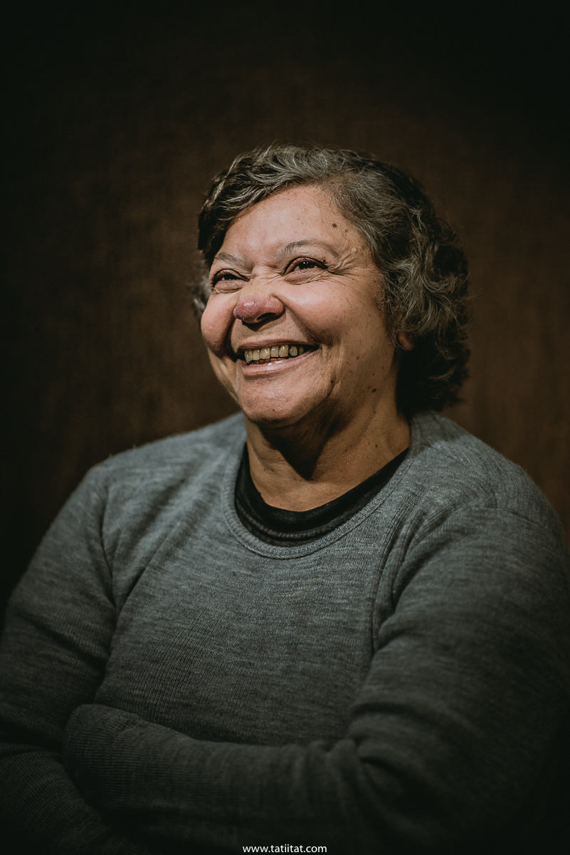 elderly woman expresses her gratitude for life when being photographed by the Brazilian photographer tati itat