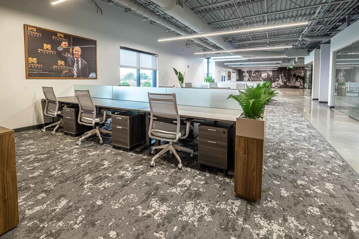 Modern office environment in Orlando, FL with sleek workstations ideal for interior and real estate photography. The design includes ergonomic chairs and contemporary décor, perfect for displaying in professional portfolios
