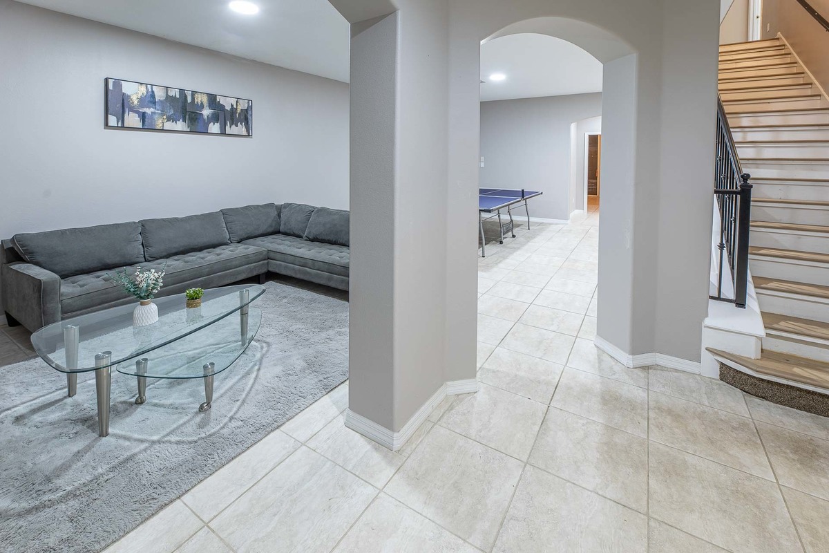 Living area with plush gray sofas and glass coffee table in Orlando, beautifully presented by an interior photographer.