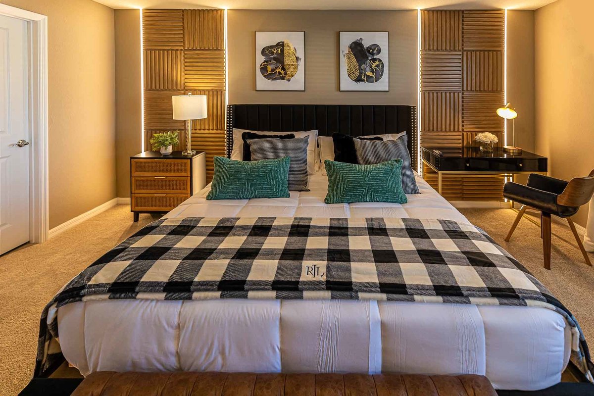 Sophisticated Double Bedroom: An interior image of a double bedroom in Orlando, highlighting a sophisticated design with wooden adorned walls and minimalist decor, reflecting a modern and elegant aesthetic.