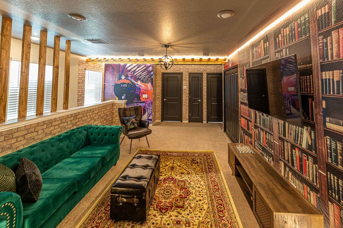 Luxurious Home Theater Room: Capturing the essence of luxury, this interior photo shows a home theater room with rich textures and ambient lighting, designed by top architects for a vacation home in Orlando.
