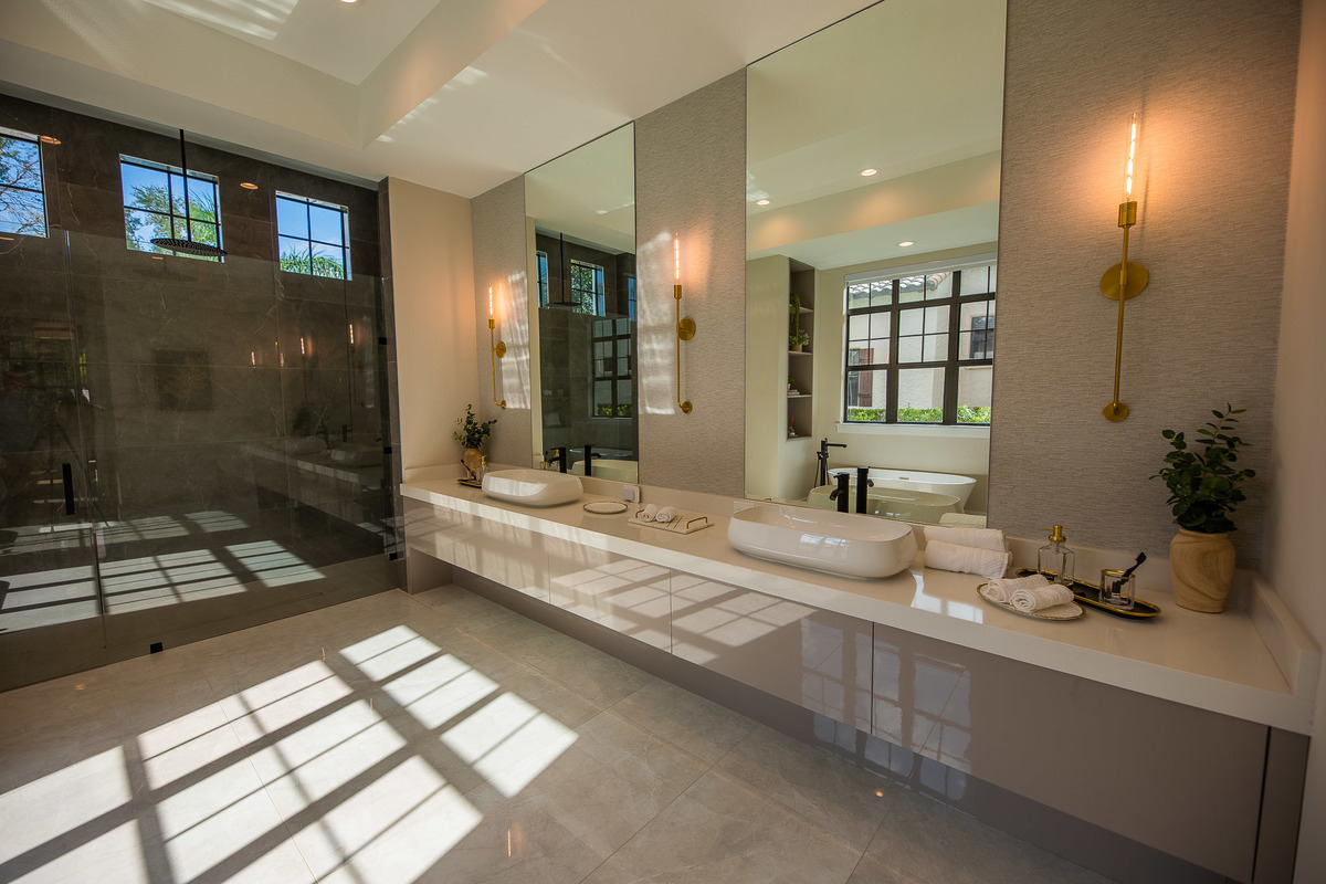 Spacious marble bathroom with a white marble jacuzzi tub in a beautiful property in the Orlando area, FL. Magic Lens Photo Media.