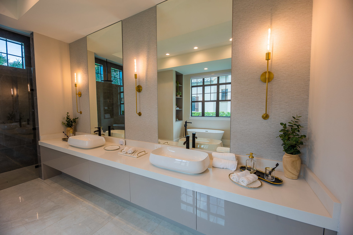 Spacious marble bathroom with a white marble jacuzzi tub in a beautiful property in the Orlando area, FL. Magic Lens Photo Media.