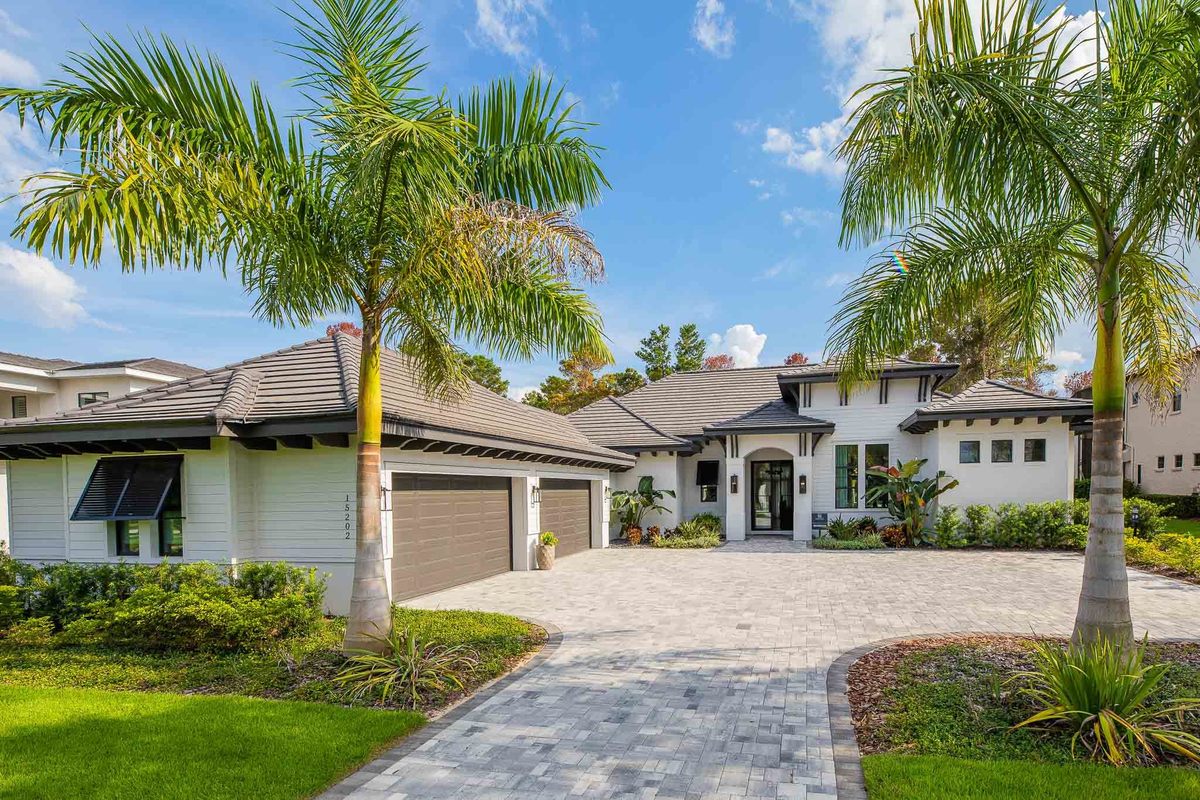 Facade of a beautiful property located in the Orlando area, FL, with a lawn and pine trees.
Facade of a beautiful property located in the Orlando area, FL, with a lawn and pine trees. Magic Lens Photo Media.
