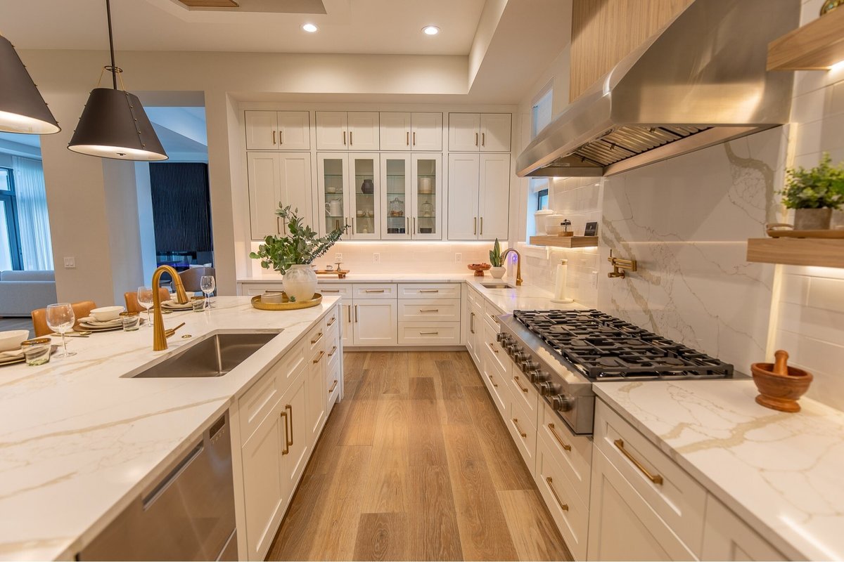 Luxurious kitchen with wooden cabinets, countertop, and beautiful chandeliers in Orlando, FL. Magic Lens Photo Media.