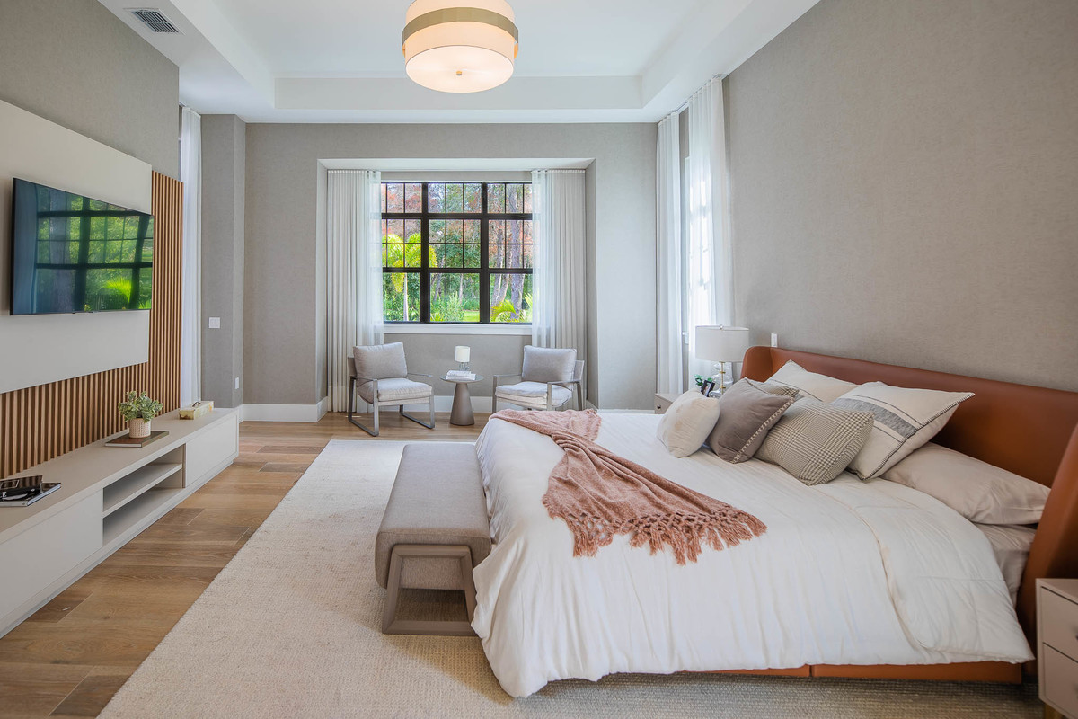 Luxurious bedroom with light beige and pink tones in a beautiful property in Orlando, FL. Magic Lens Photo Media.