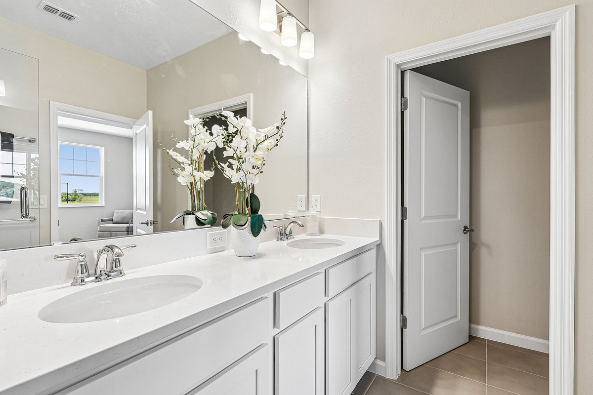 master-bathroom-double-sink-vanity-large-mirror-private-water-closet-white-cabinets-5348-ctr-lk-rnch-blvd-st-cloud-fl