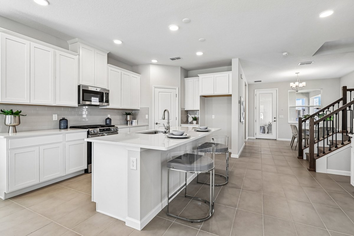 modern-white-kitchen-quartz-island-countertop-stainless-steel-appliances-subway-tile-backsplash-5348-ctr-lk-rnch-blvd-st-cloud-fl