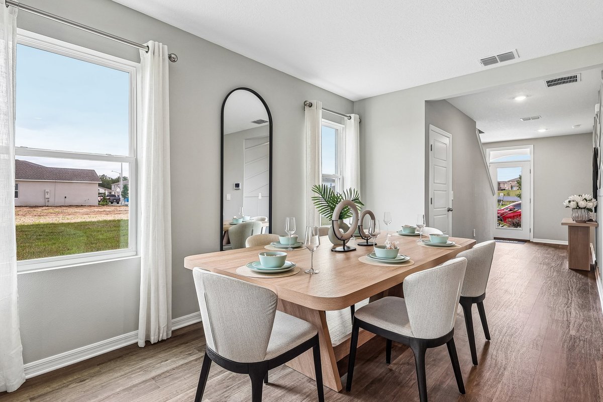 Elegant dining area connected to the kitchen and living room.