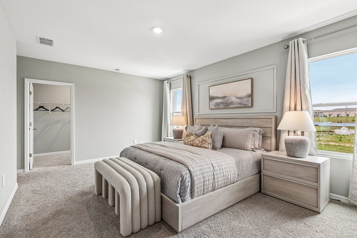 Relaxing primary suite designed for comfort and tranquility.