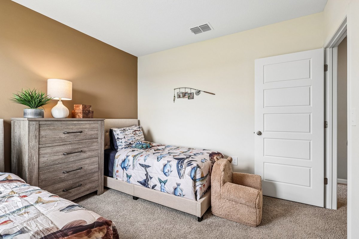 Versatile bedroom suitable for family members or guests.