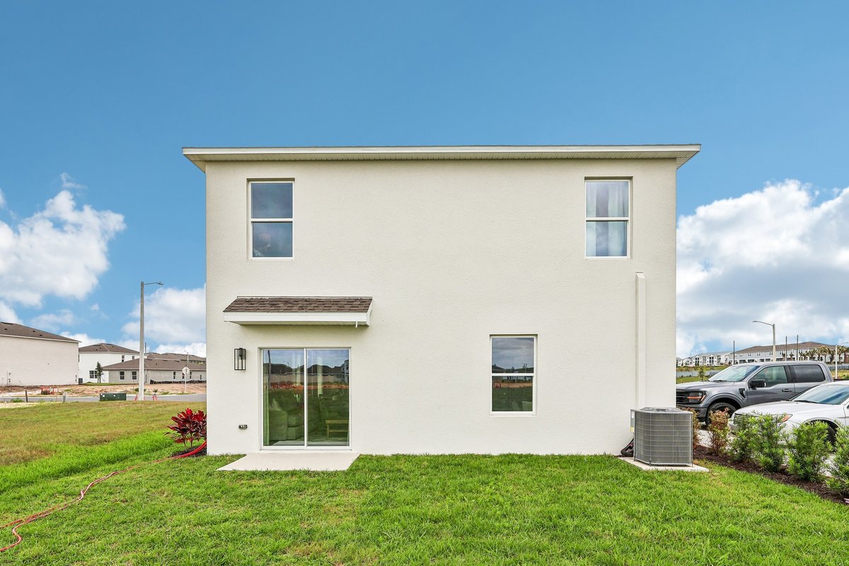 Rear exterior view of a professionally photographed model home.