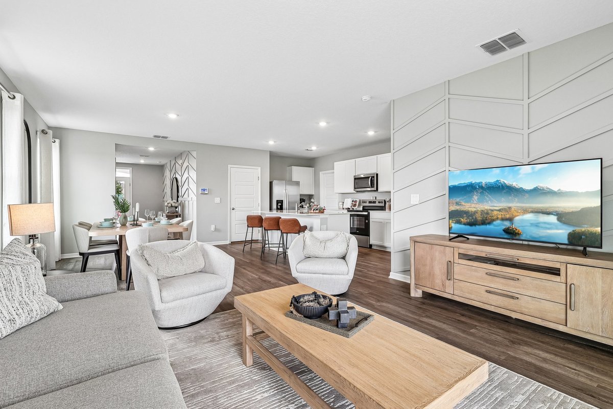 Open-concept living room designed to maximize natural light.