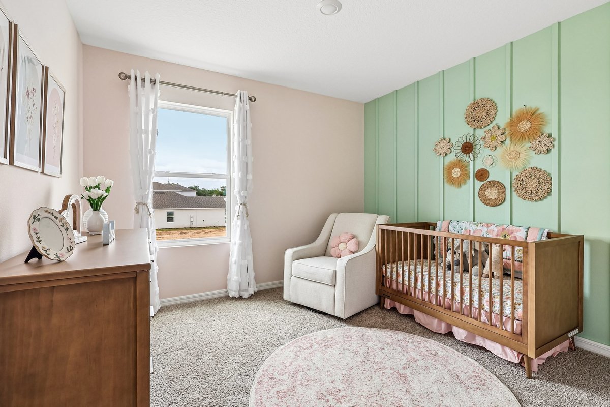 Comfortable secondary bedroom showcasing flexible living space. Baby