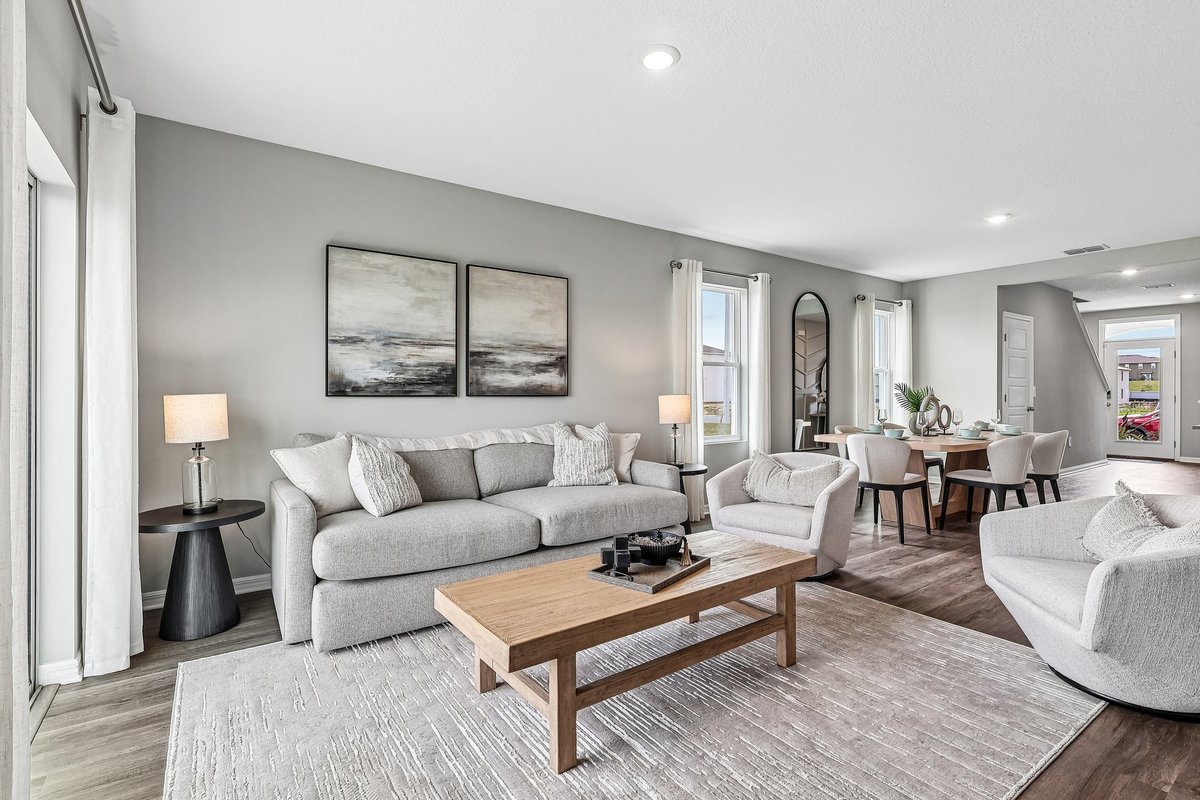 Open-concept living room designed to maximize natural light.