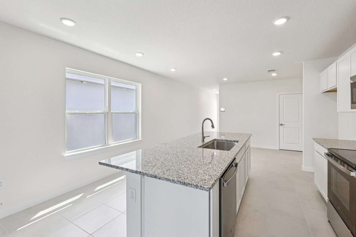 Granite kitchen island with natural light in Winter Haven FL