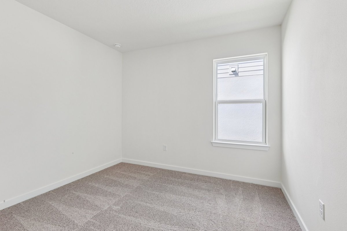 Bright bedroom with natural light and tray ceiling in Winter Haven FL
