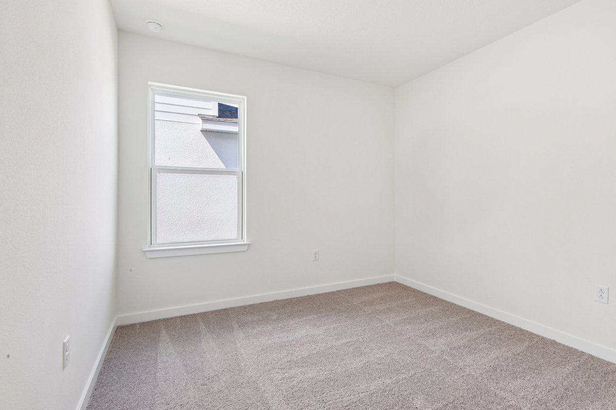 Third bedroom with double closet doors in new construction
