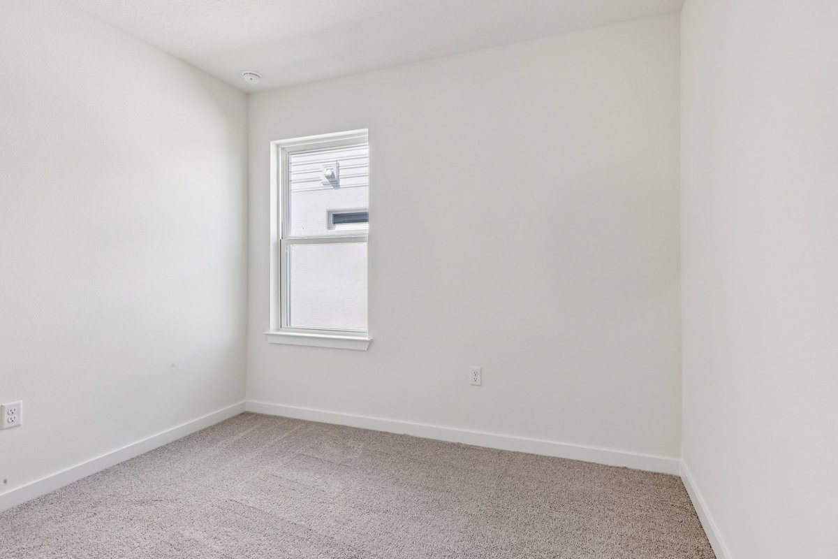 Third bedroom with double closet doors in new construction