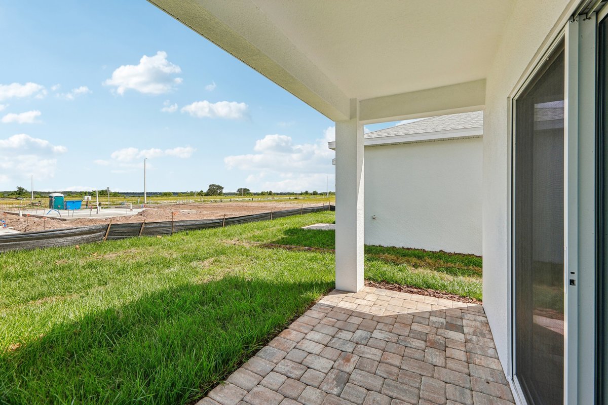 Covered patio with open backyard view in Winter Haven FL