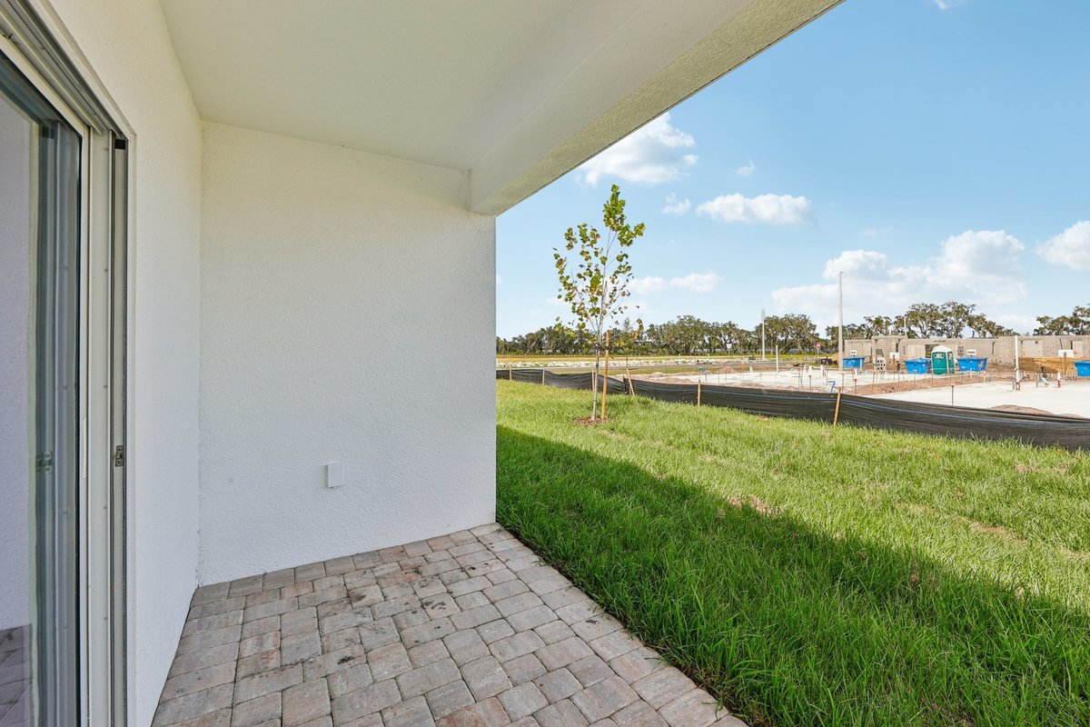 Covered patio with open backyard view in Winter Haven FL