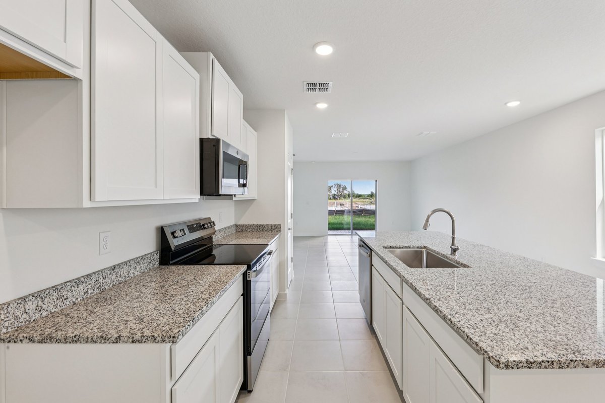 Granite kitchen island with natural light in Winter Haven FL