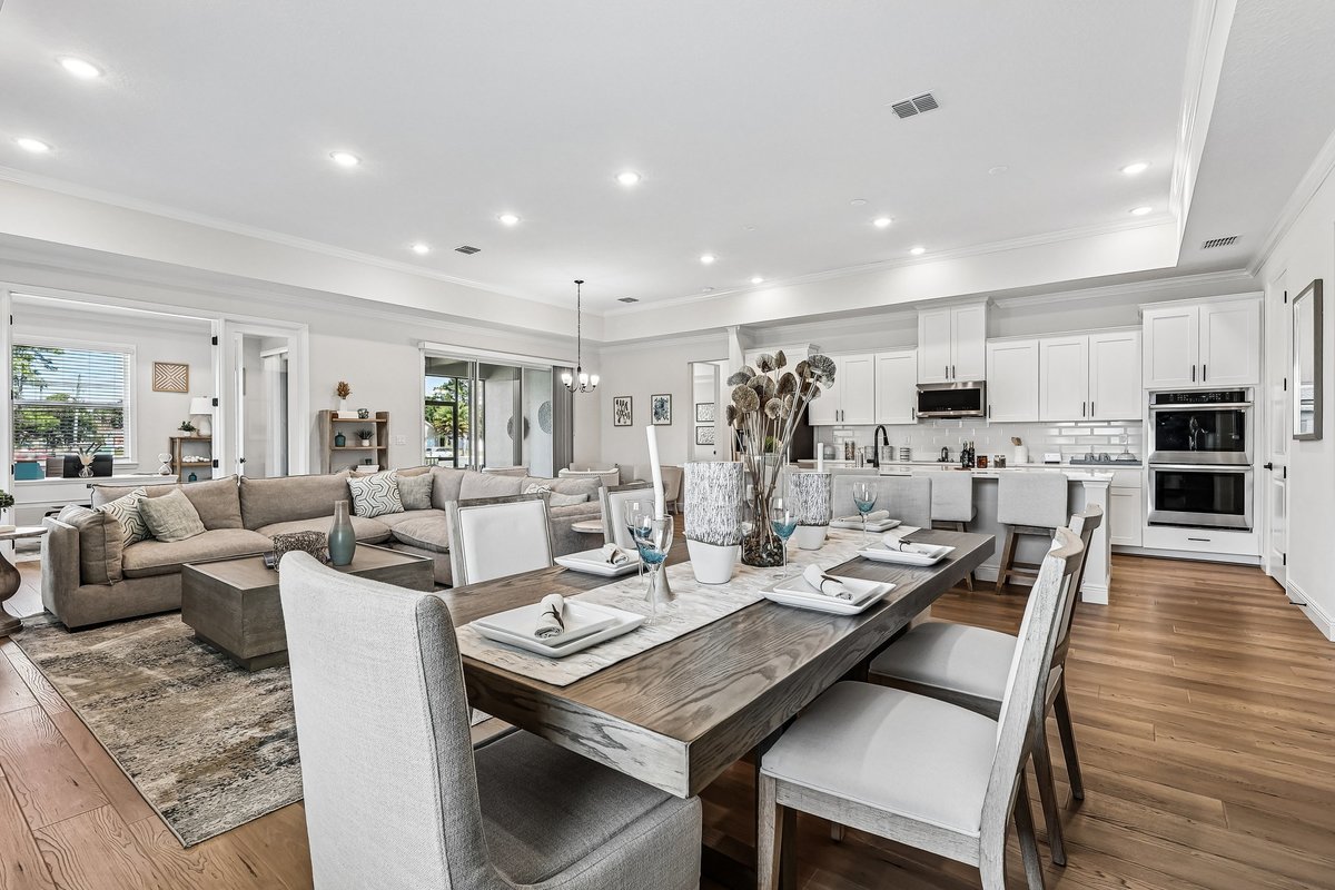 Staged dining area with coastal decor in a Palm Bay model home