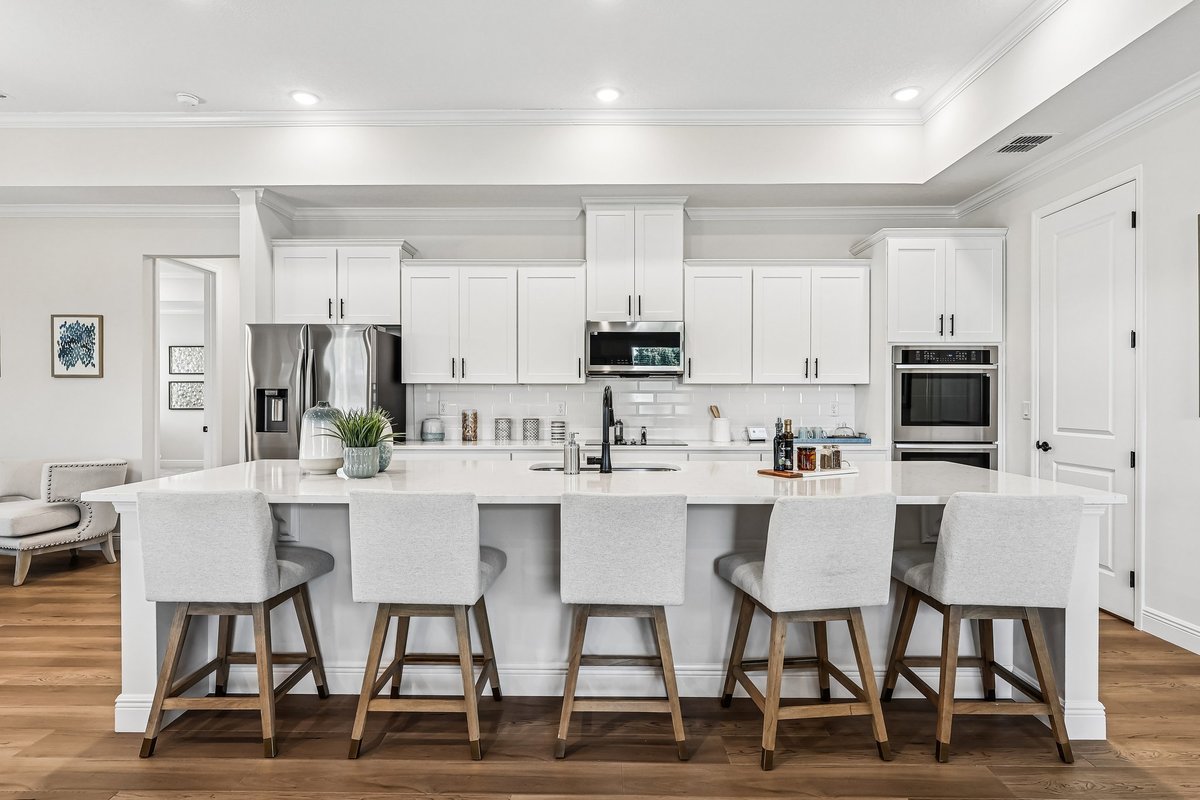 Large white kitchen island with bar seating in Palm Bay FL new construction home