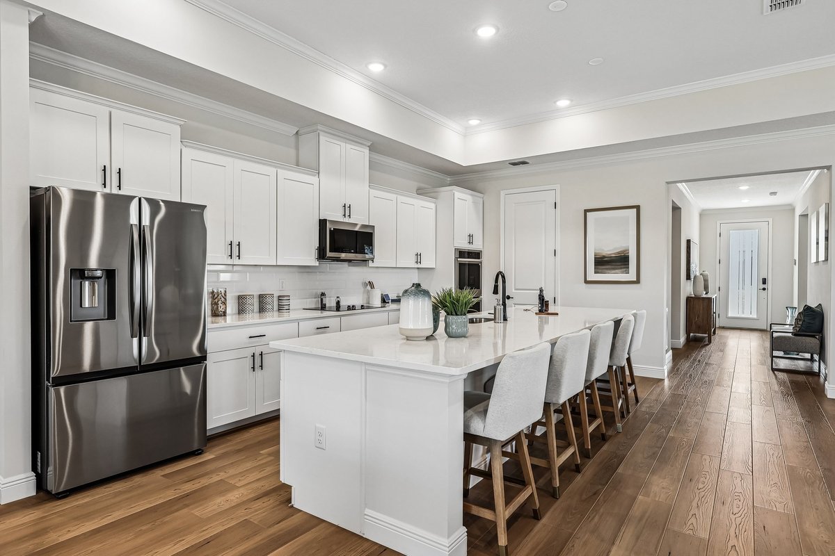 White kitchen with stainless steel appliances and black hardware in Palm Bay FL