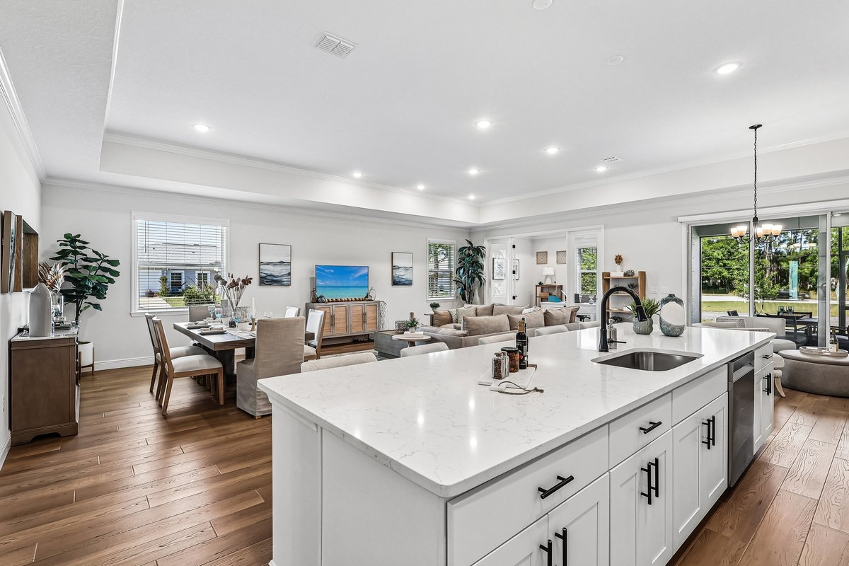 White kitchen with stainless steel appliances and black hardware in Palm Bay FL