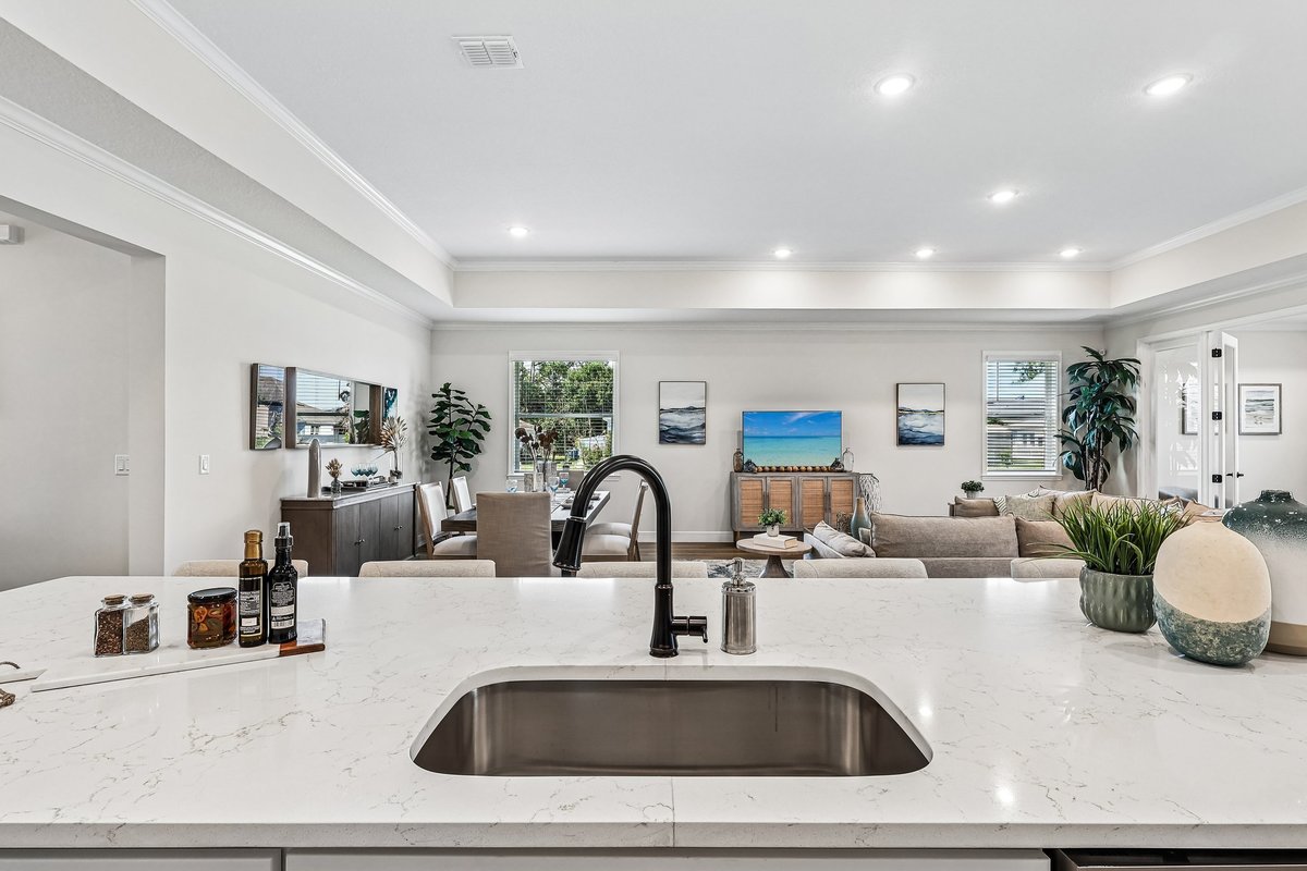 White kitchen with stainless steel appliances and black hardware in Palm Bay FL