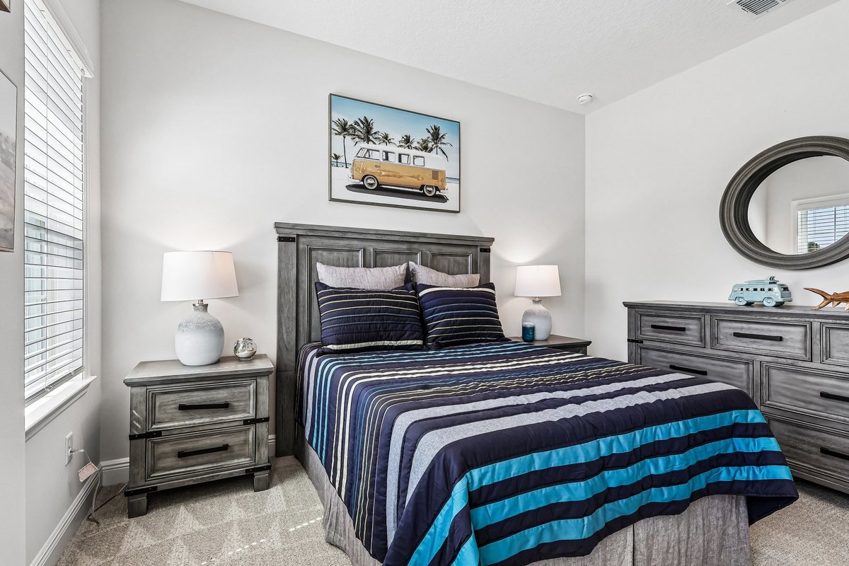 Staged coastal bedroom with blue accents in Palm Bay FL