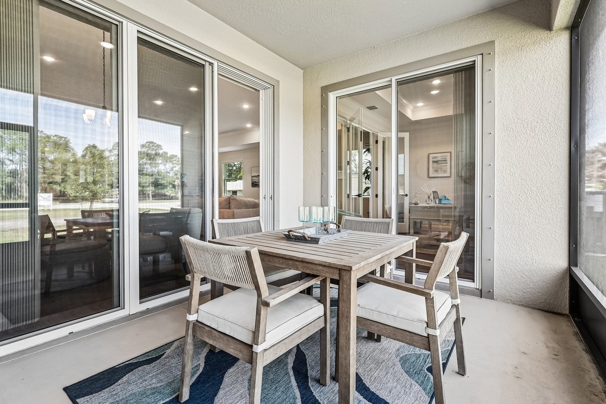 Covered patio with outdoor dining furniture in Palm Bay FL home