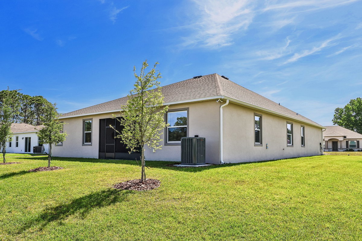 CovereBack exterior of a Maronda Homes property in Palm Bay FL with 