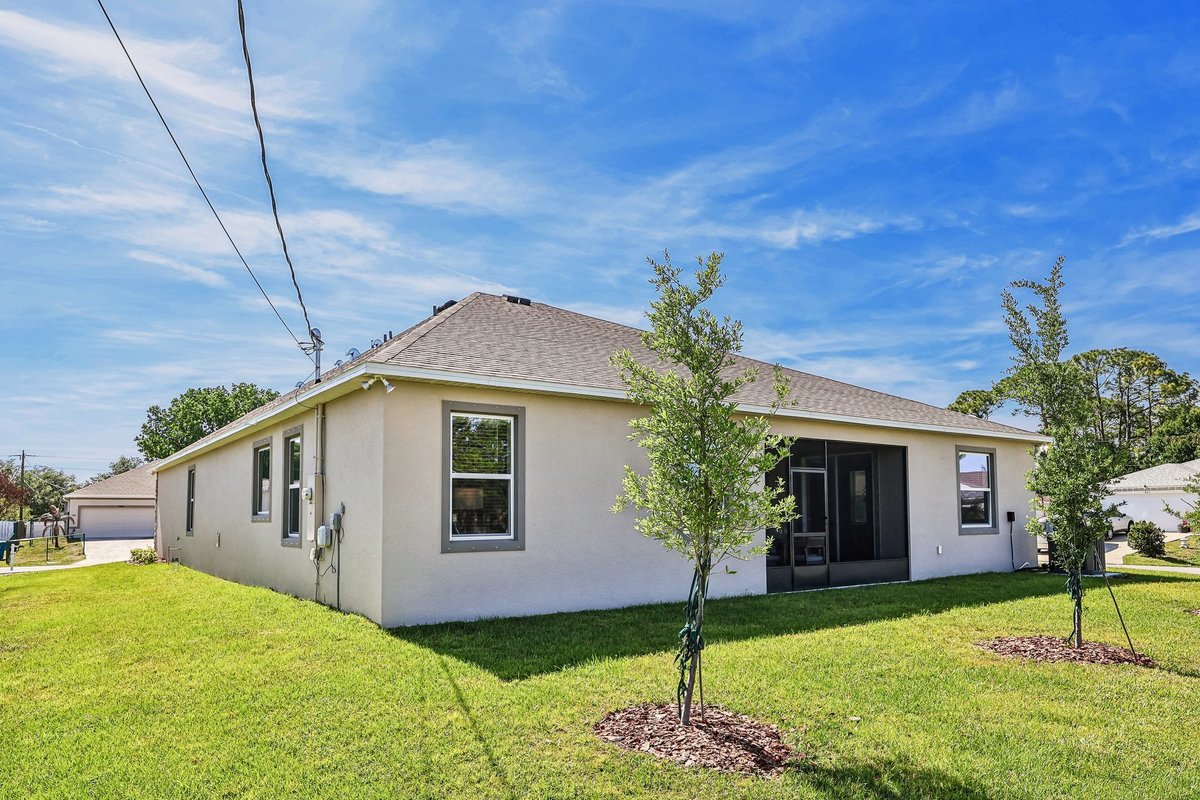 CovereBack exterior of a Maronda Homes property in Palm Bay FL with 