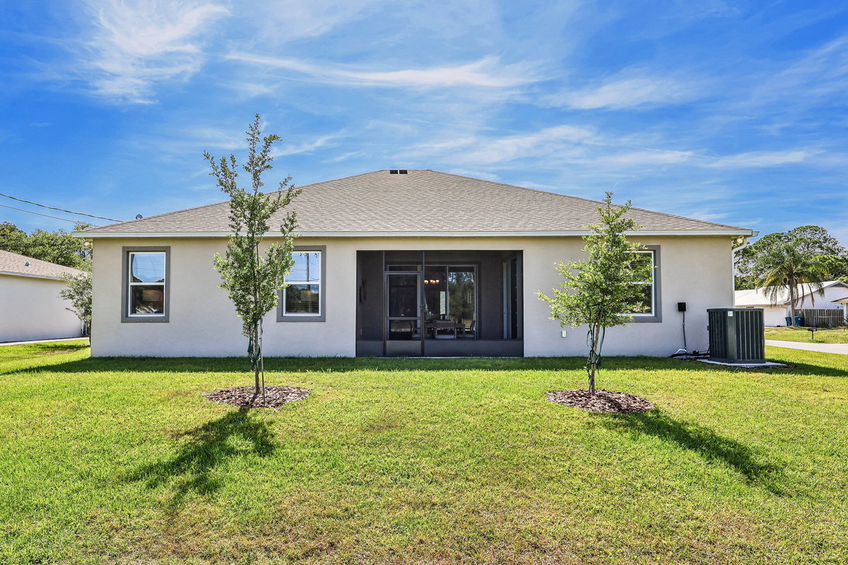 CovereBack exterior of a Maronda Homes property in Palm Bay FL with 