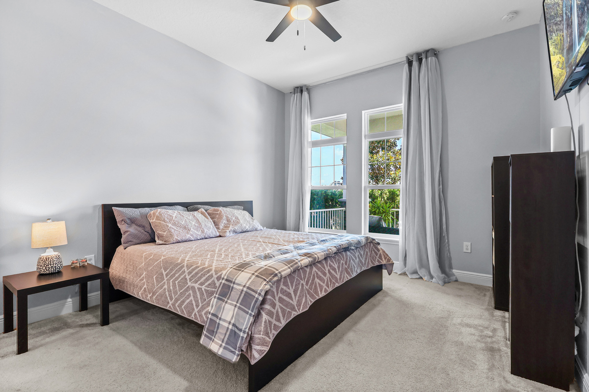 Large bedroom with balcony doors in Winter Garden FL home