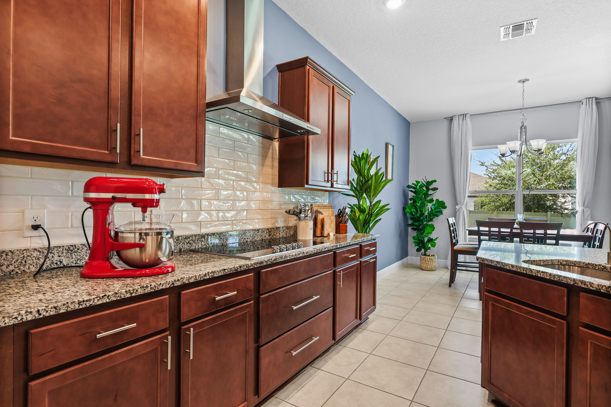 This angle connects the kitchen, dining area, and living spaces for better buyer understanding.