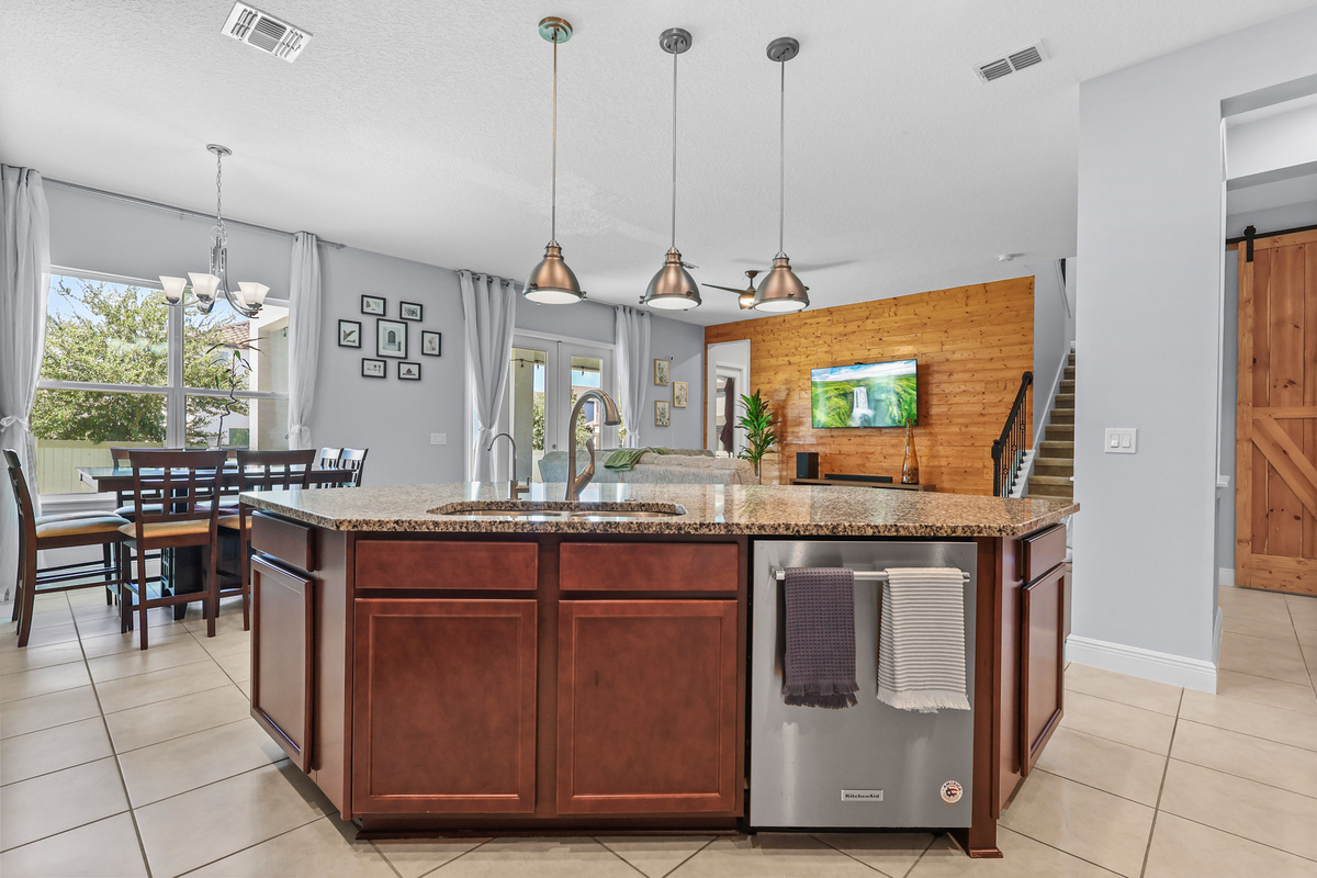 The kitchen shows functional space, warm cabinetry, and buyer-friendly layout.