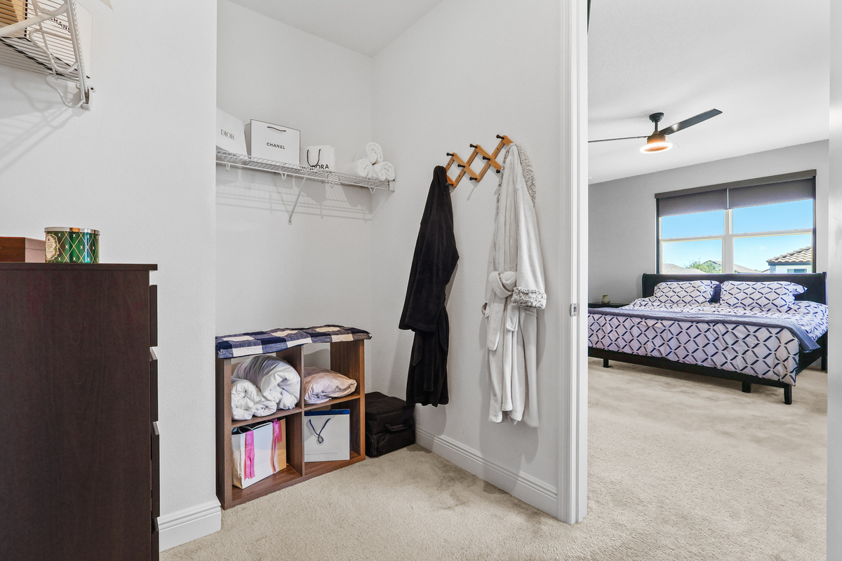 The closet shows scale, natural light, and access to outdoor space.