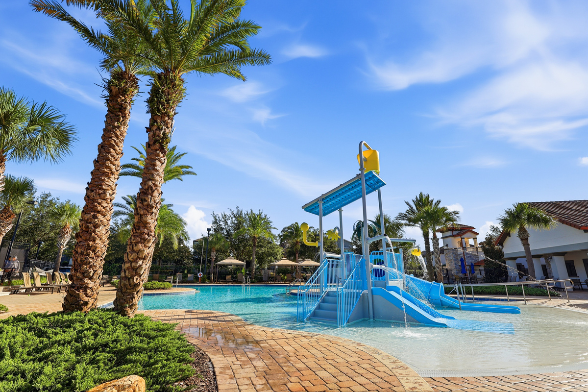 Community pool and splash pad photography adds lifestyle value to the listing.