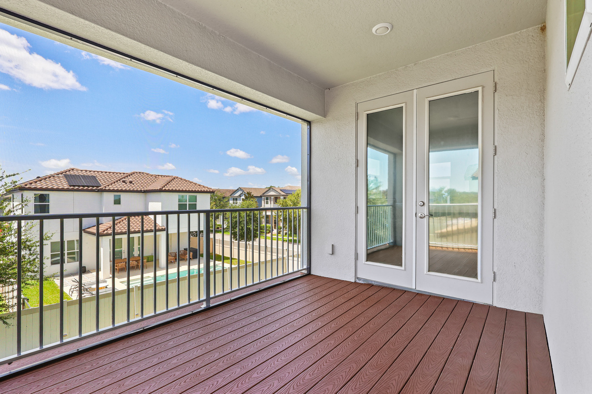 Large balcony bedroom with balcony doors in Winter Garden FL home