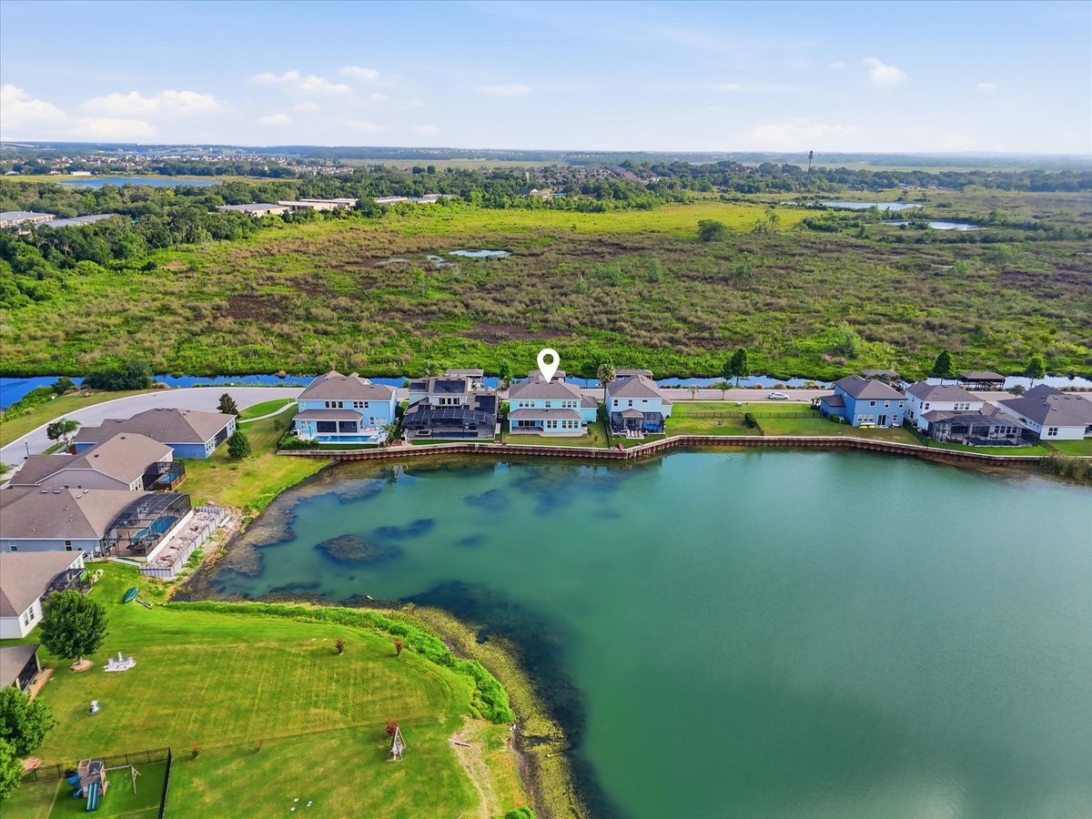 Drone image marking the location of 343 Blue Cypress Dr near the lake in Groveland FL
