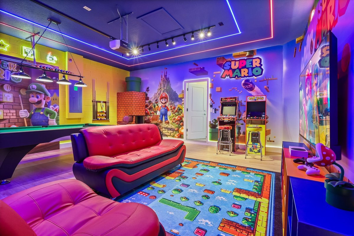 Immersive Mario game room with billiards, arcade machines, neon ceiling lights and colorful themed decor.