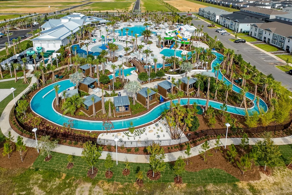 Aerial view of Windsor Cay Resort amenities with pools, lazy river, cabanas and landscaped recreation areas.
