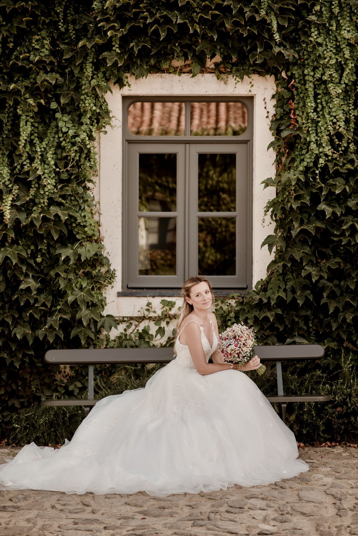 Bride showing Pronovias Marchesa gown details at São Lourenço do Barrocal wedding
