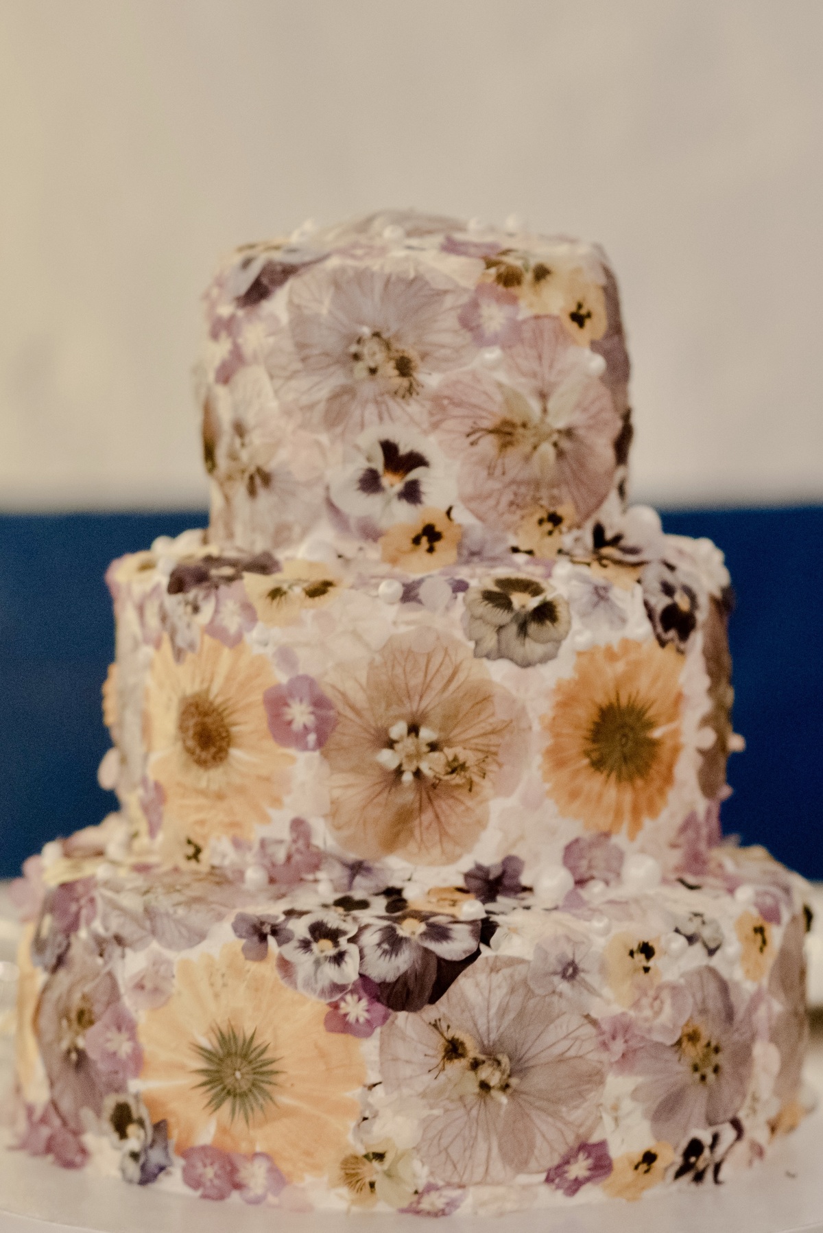 Wedding cake decorated with flowers at a wedding at São Lourenço do Barrocal, Portugal.