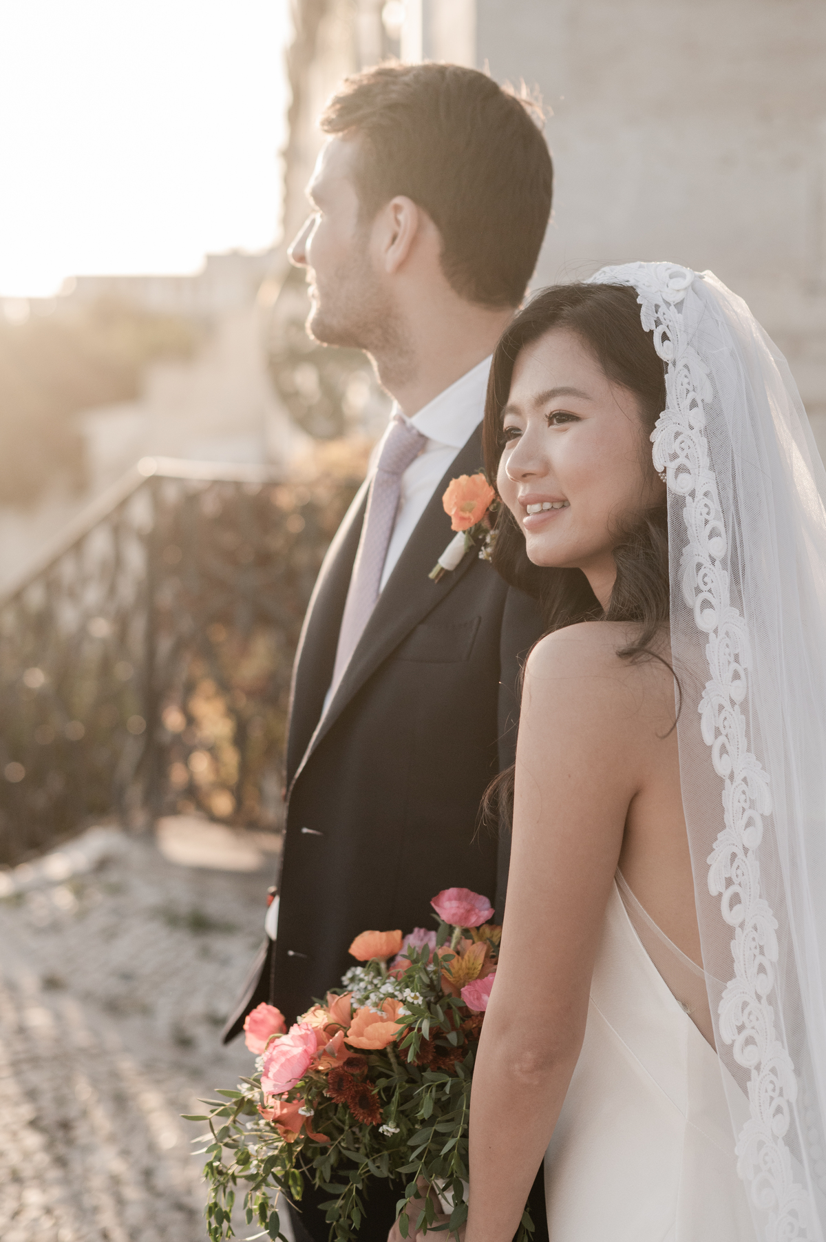 Bride-and-groom-smilling-at-the-Lisbon's-sun-after-the-ceremony
